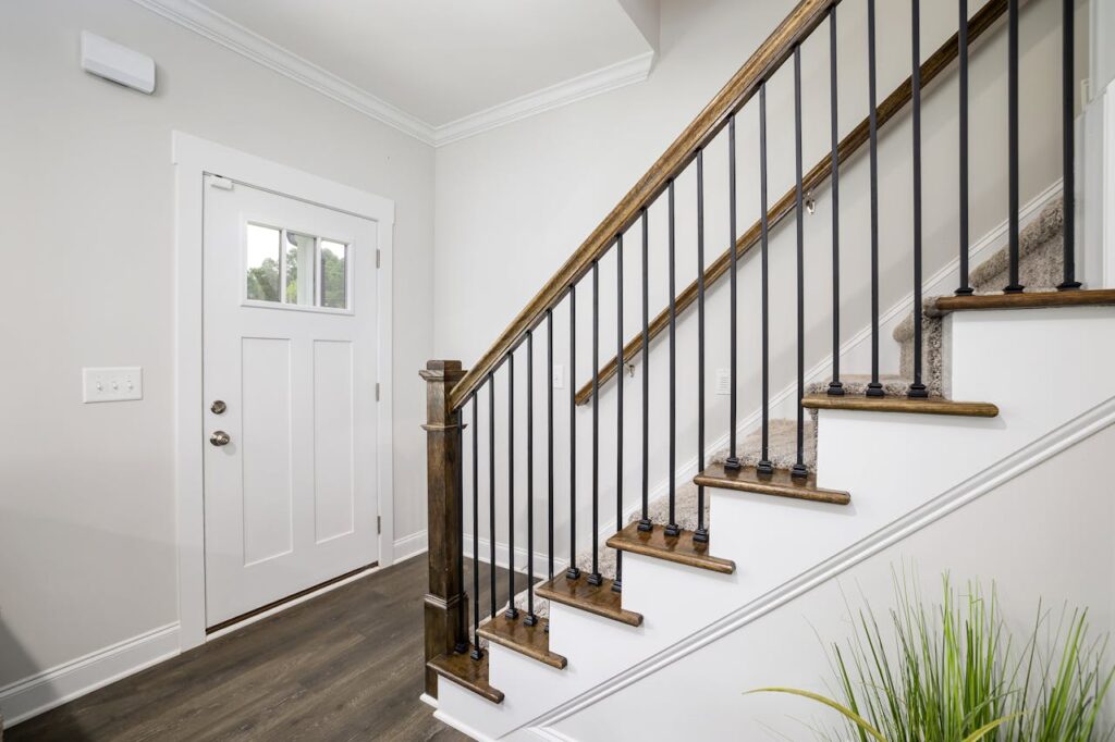 pexels-photo-10099322 Bright and clean modern stairway with wooden accents and white trim in a minimalist home.